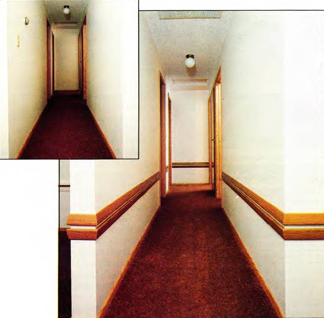 Molding in a long hallway help break the tall walls into shorter pieces
