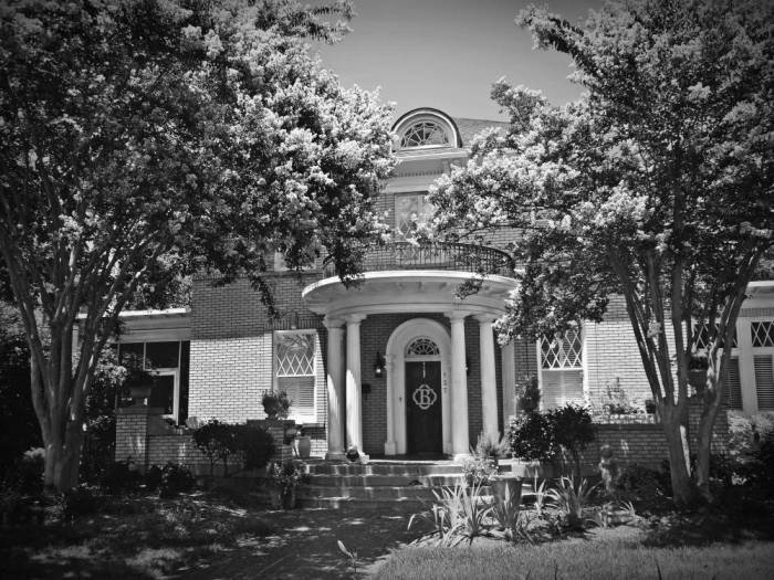 black and white photo of a beautiful shaded front porch for energy savings