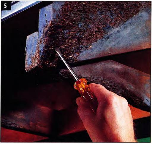 Probe the rotted wood to understand the damage extent and let the moist wood dry before proceeding with the repair
