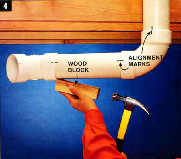 After dry-fitting pipes, use a wooden block and a hammer if the sections are stuck together
