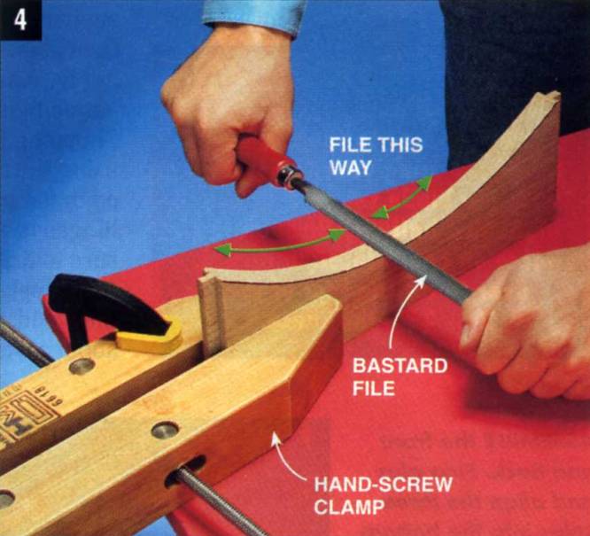 stabilize the workpiece with a hand-screw clamp and use a bastard file to smooth the edges of the arch on the bottom rails