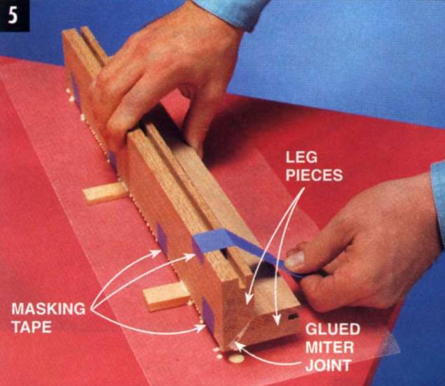 simply use masking tape to clamp mitered workpieces