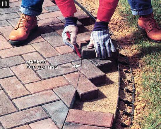 Use a paver to mark the distance needed for the border pavers and cut them one by one