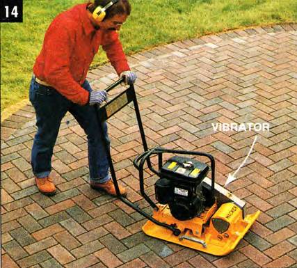 Use the flat-plate vibrator to even the surface and lock the pavers into the sand