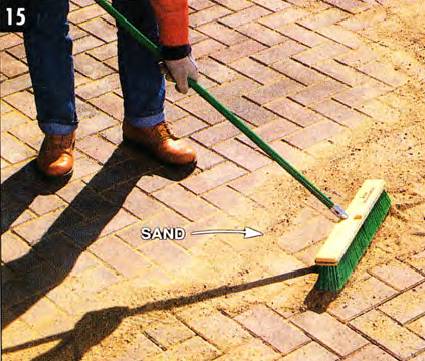 Sweep coarse dry sand between the cracks to fill voids and lock them together