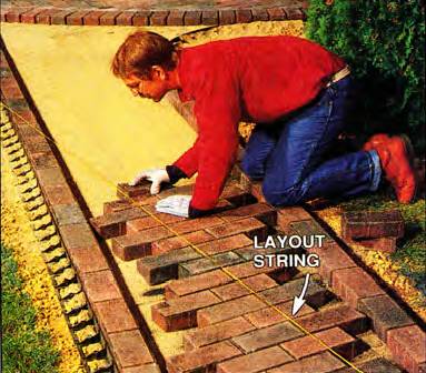 Use a string as a guideline and start laying pavers