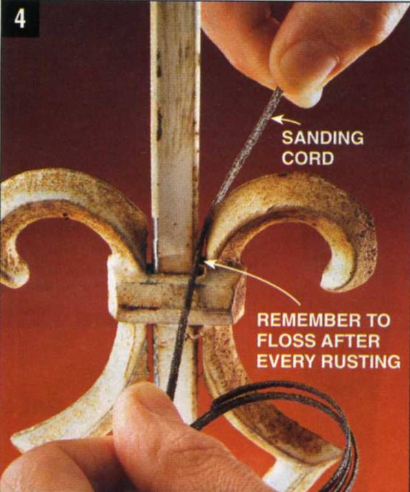 You can reach hard spots with a sanding cord, much like flossing your own teeth