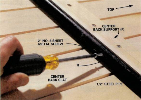 Drill a hole in the center of the rear support pipe and screw it into the center back support to keep the pipe from sliding to one side or the other