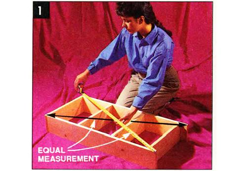 Measure the diagonals for equal dimensions and a square box