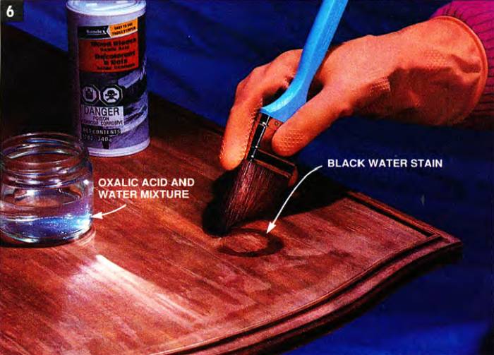 Bleach black water stains with an oxalic acid solution - perhaps in two separate sections