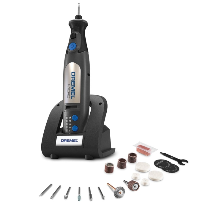cordless dremel rotary tool with its charging base and 18 accessories