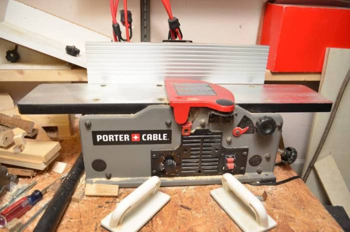 Porter Cable PC160JT on the top of a workbench among other hand tools