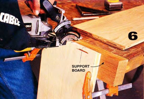 Placing biscuit slots in the ends is easier when you use a support board as in this picture