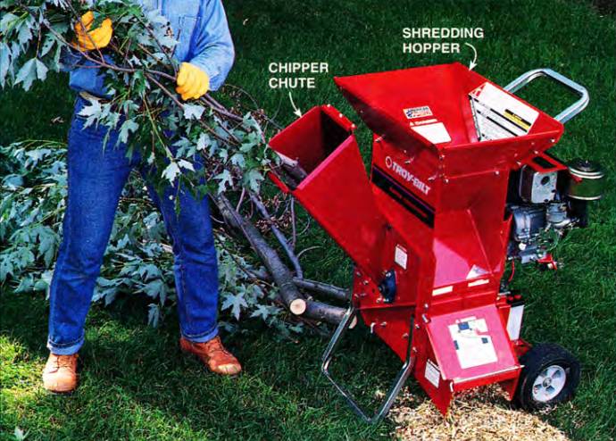 chipper-shredder ready for action, showing its chipper chute and shredding hopper