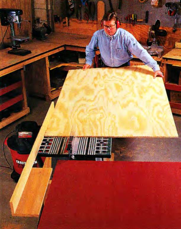 The long-bed fence and the outfeed table, combined, are a great help in supporting awkward, heavy workpieces such as a full sheet of plywood