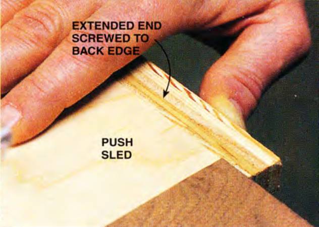 In the detail you can see how the push sled supports the workpiece and keeps you safe